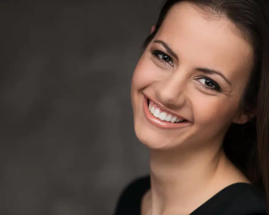 Take Your Life Back with TMJ Treatment young woman with a happy smile thanks to dentistry in Wilmington, North Carolina